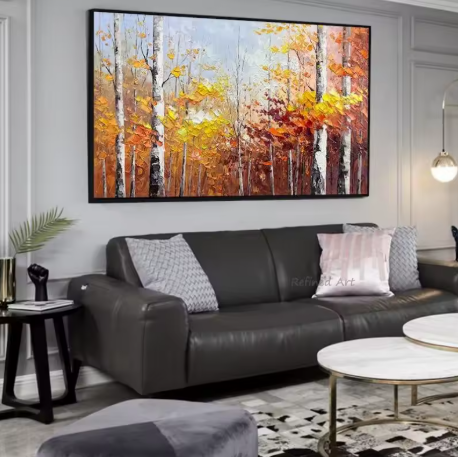 Living room with a large abstract painting of autumn trees with a black frame