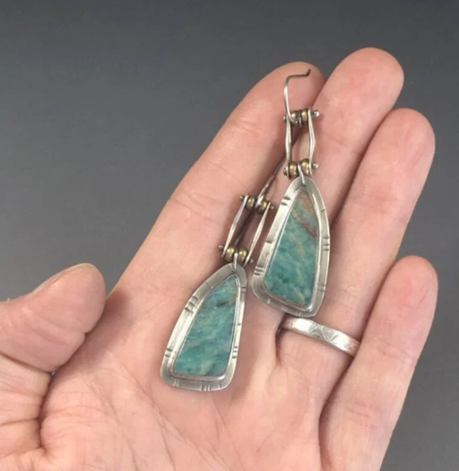 bohemian turquoise earrings in palm