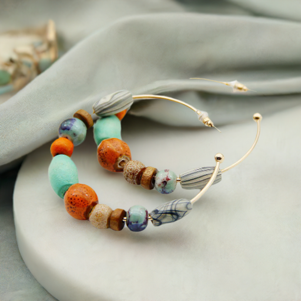 bohemian earrings next to towel