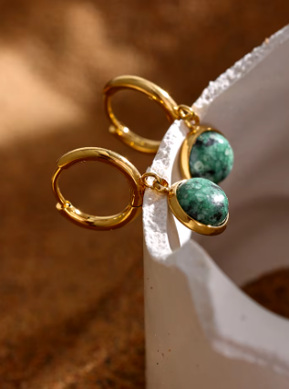 gold hoops with green stone