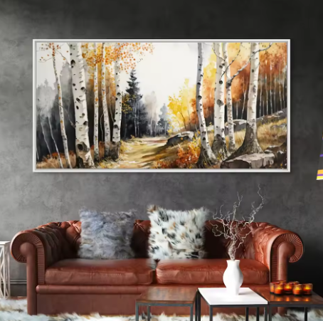 Painting of birch trees in an autumn landscape hanging above a brown leather sofa.