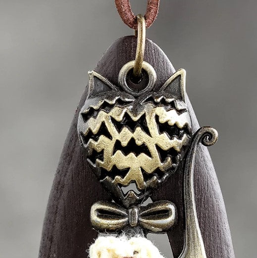 brown wood meow necklace close up