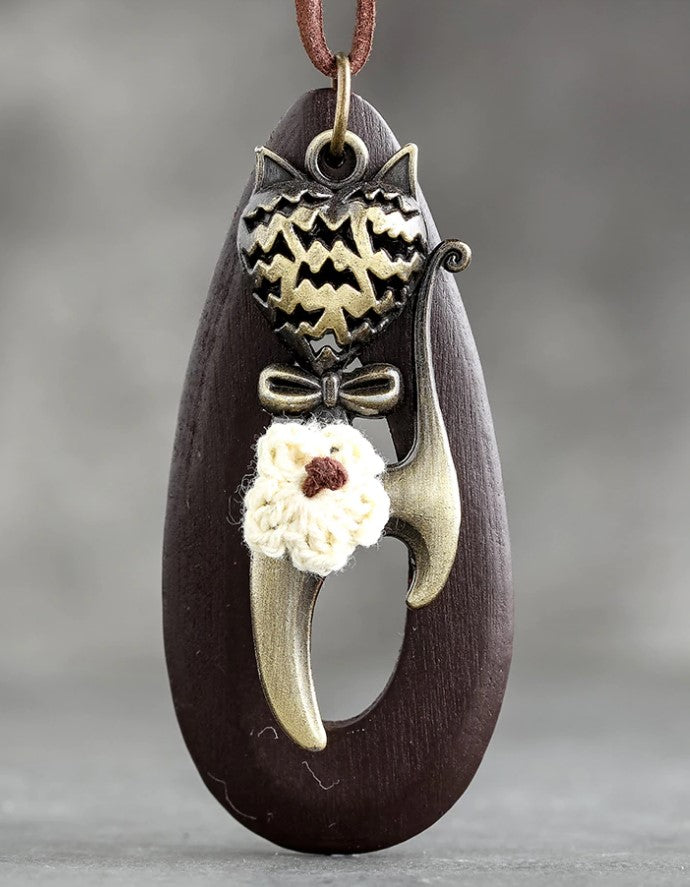 brown wood meow necklace hanging