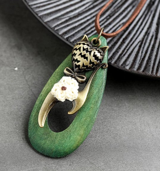 green meow necklace close up