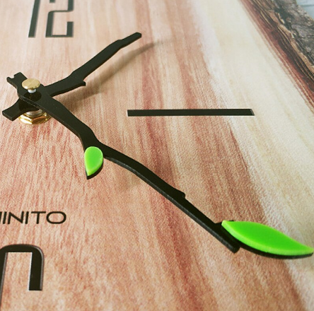 close up of split log clock showing hands