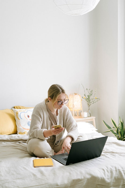 home office-girl working on bed