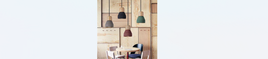 wood and cement droplights over kitchen table