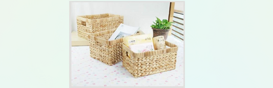 woven baskets sitting on the floor filled with items