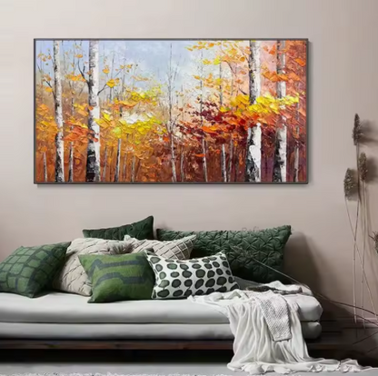 Living room with a large abstract painting of autumn trees on the wall above a sofa.