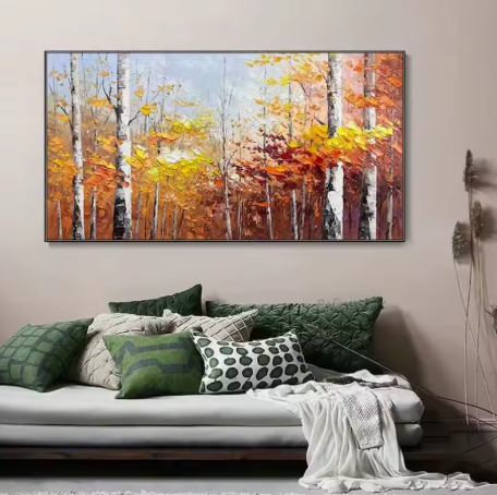 Living room with a large abstract painting of autumn trees on the wall above a sofa.