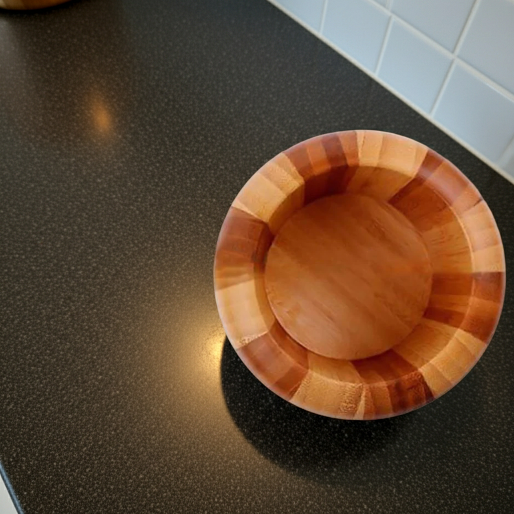 Wooden mortar container on a dark countertop with tiled wall in the background