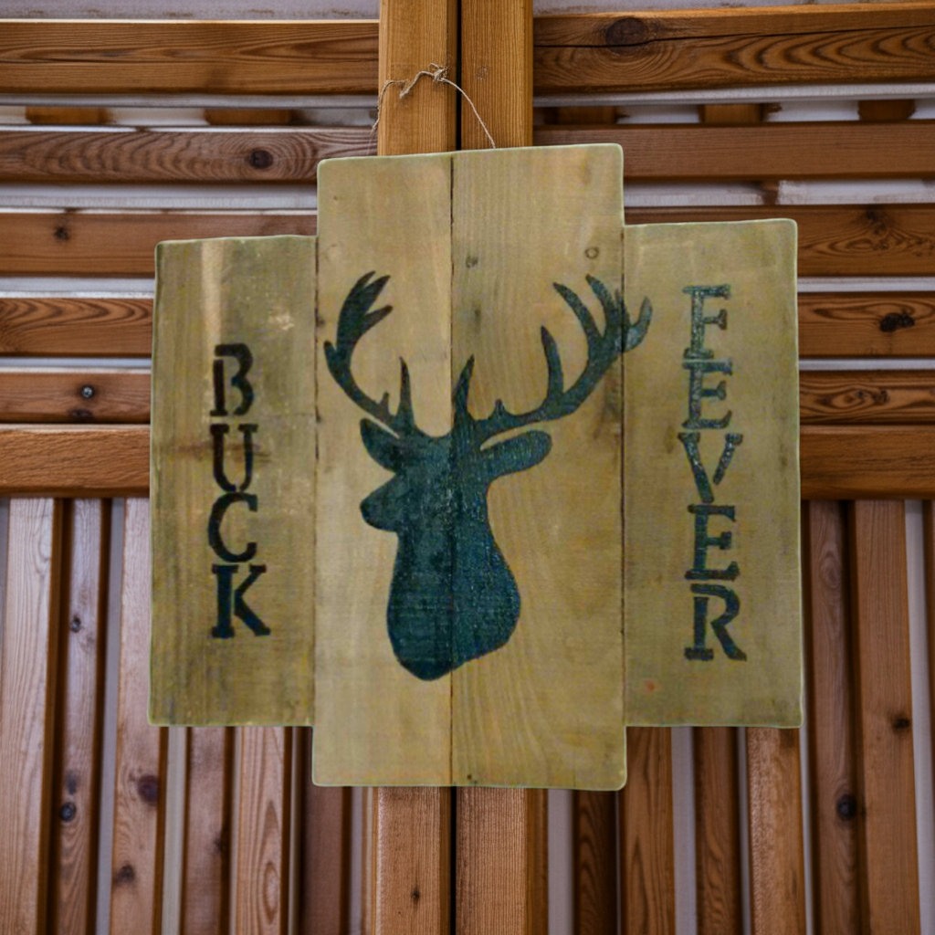 Wooden sign with deer silhouette and 'Buck Fever' text against a wooden background