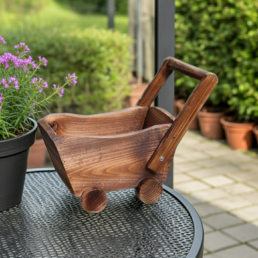Wooden planter cart on a table with potted plants in the background