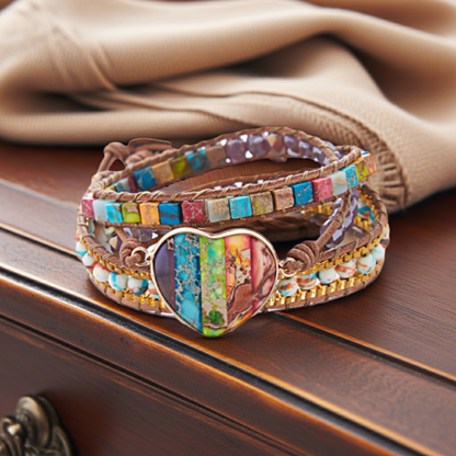 Colorful beaded bracelet with a heart charm on a wooden surface
