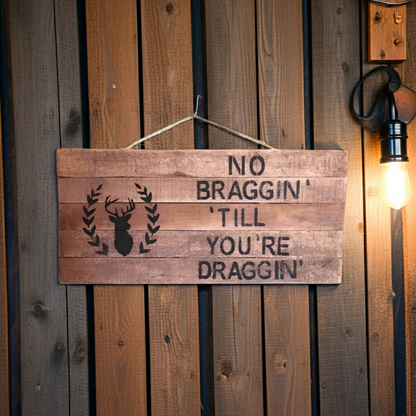 Wooden sign with text and deer silhouette on a wooden wall.
