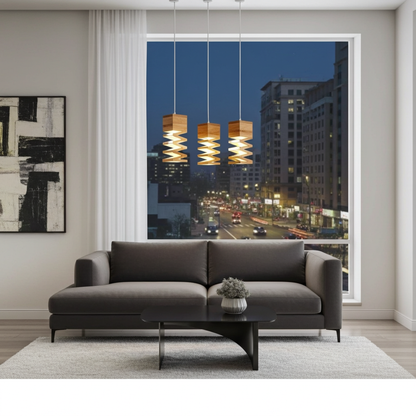 Modern living room with a gray sofa, coffee table, and pendant lights, featuring a cityscape view through a large window.