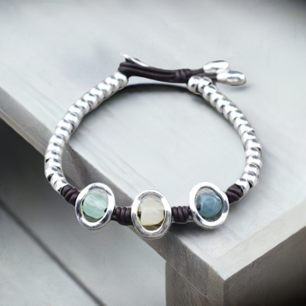 silver bead bracelet on dresser