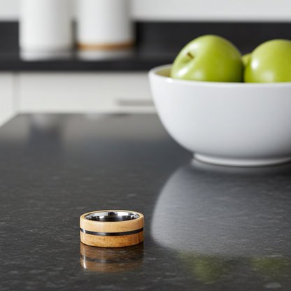 Wooden ring on a dark surface with a bowl of green apples in the background