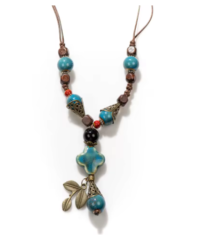 Necklace with blue and brown beads on a white background