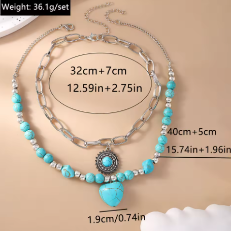 Necklace with turquoise beads and heart pendant on a beige background-measurements