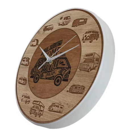 Wooden wall clock with engraved designs of vans and trailers on a white background