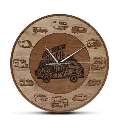 Wooden clock with engraved camper van designs on a white background