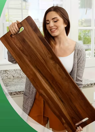 Woman holding a large wooden cutting board indoors