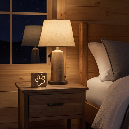 Bedroom with wooden nightstand, lamp, and decorative light