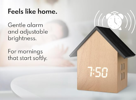 House-shaped digital clock with adjustable brightness and alarm feature on a white background