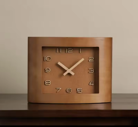 Brown square clock on a wooden surface with a beige background