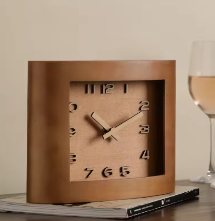 Wooden clock on a surface with a glass 
