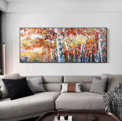 Abstract painting on a wall above a gray sofa in a living room.