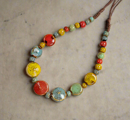 Necklace with colorful beads on a textured surface