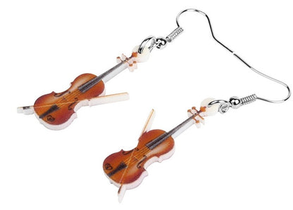Violin-shaped earrings on a white background