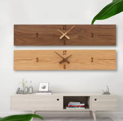 Two wooden wall clocks on a white wall with a light-colored cabinet below.