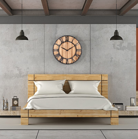 wood wall clock over bed