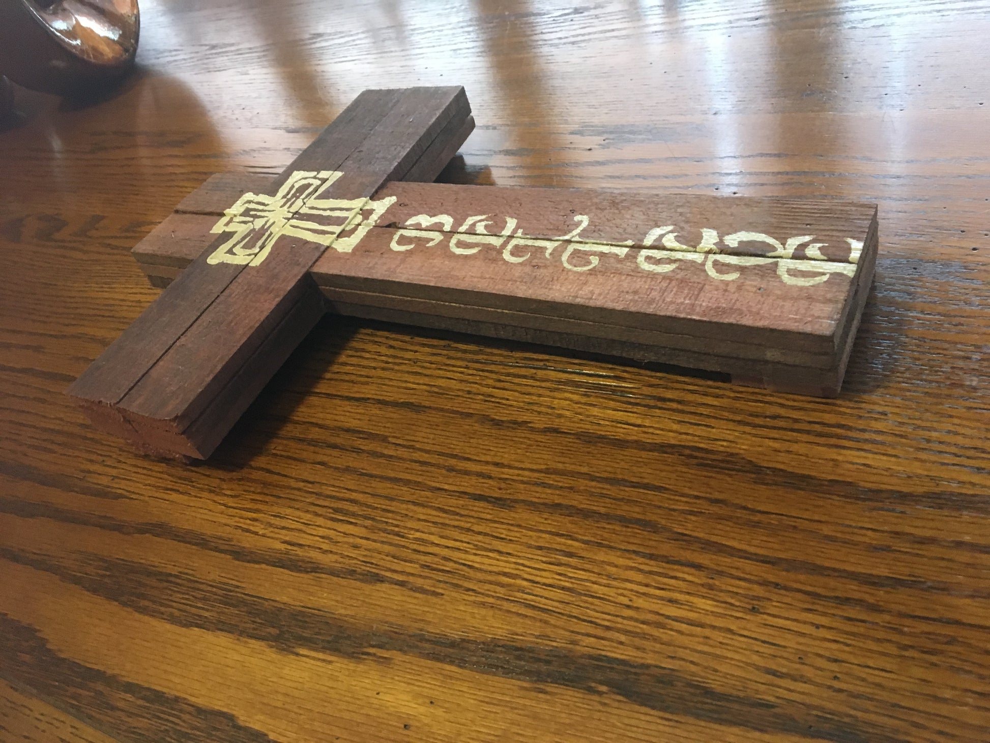 Believe wood sign on table