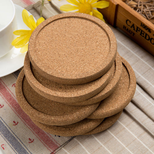 Wood coasters with cork-stacked on table