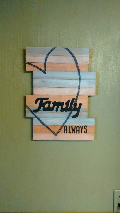 pallet wall art on green wall