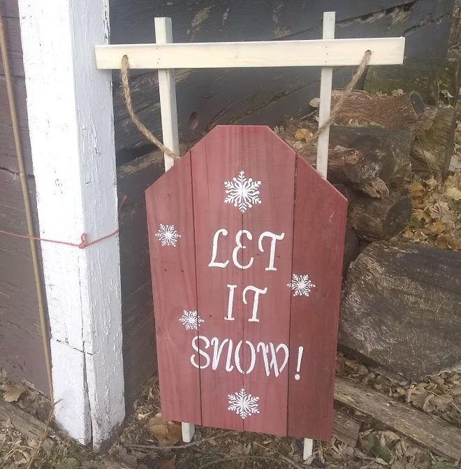 Let it snow pallet sign near barn