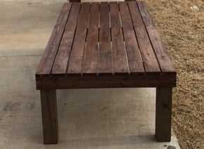 treated wood bench absorbs stain differently