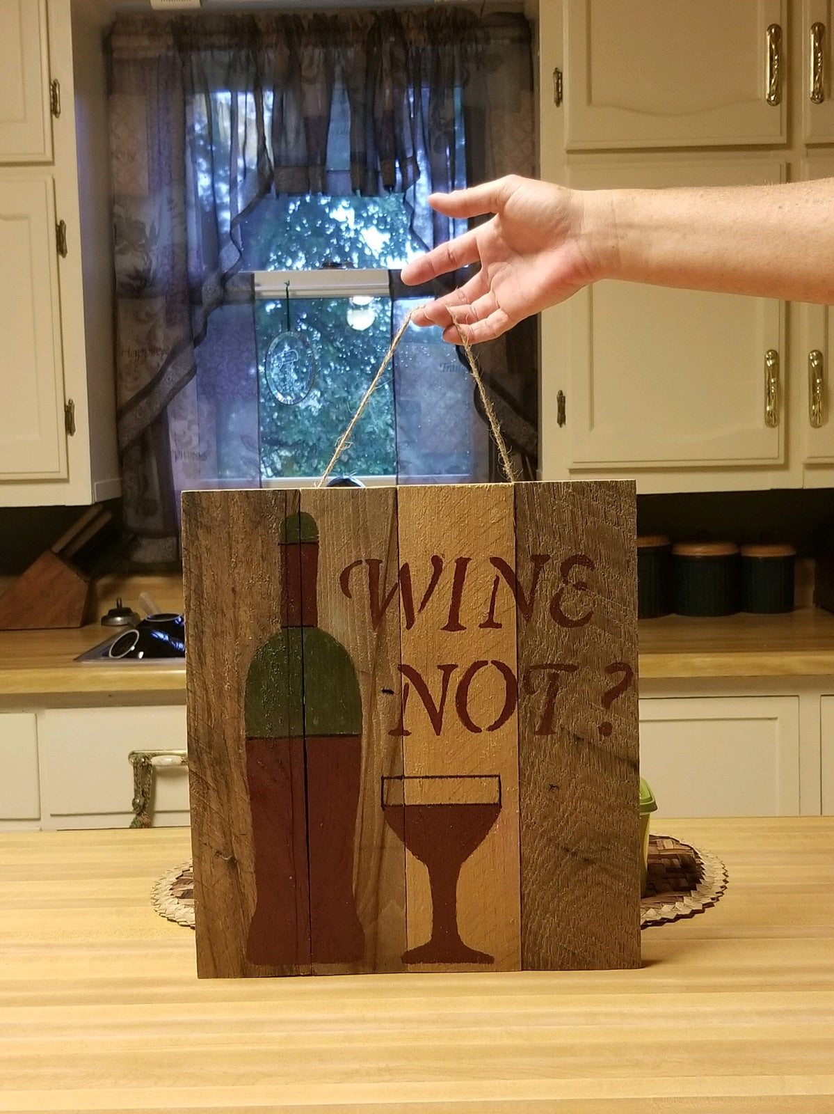 wine not pallet sign in customers kitchen
