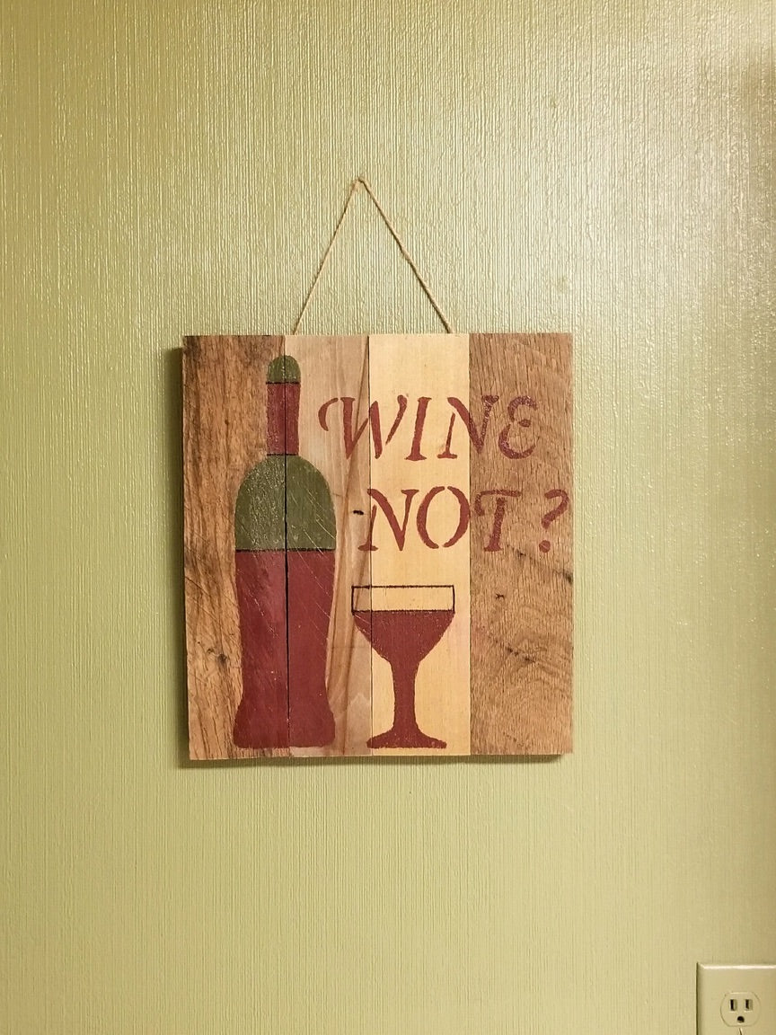 wine pallet sign hung on kitchen wall