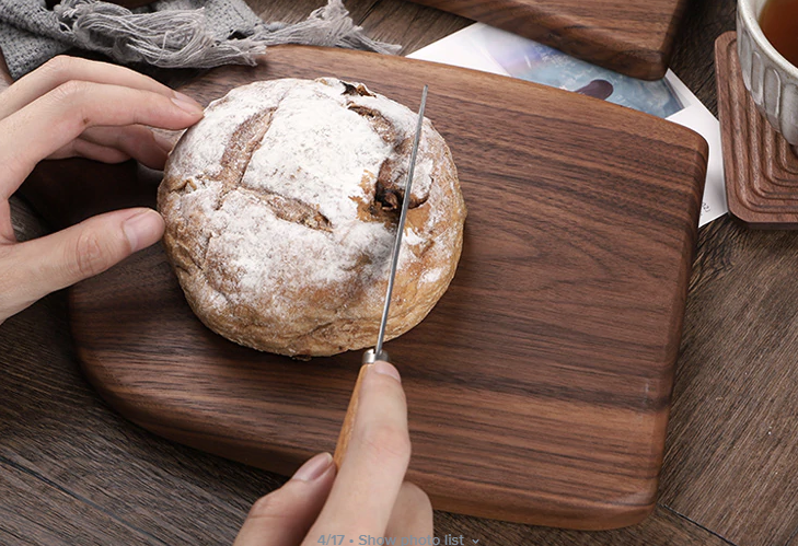black walnut cutting board with bread