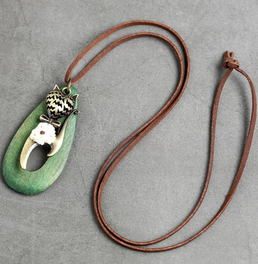 green meow necklace with rope