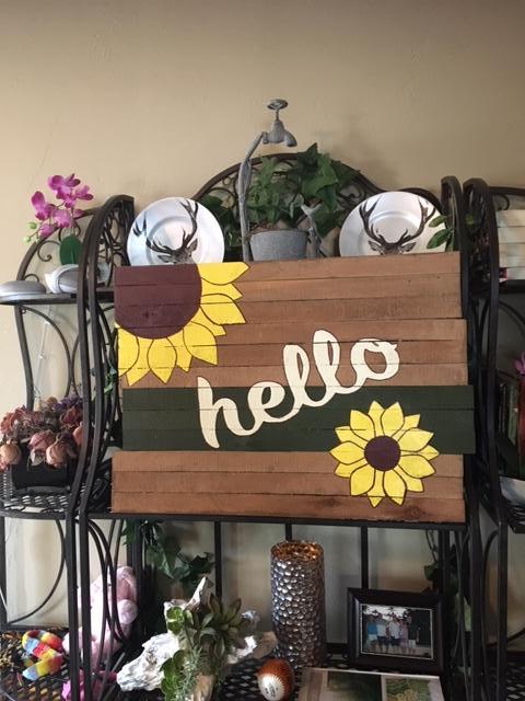 sunflower sign with full shelf