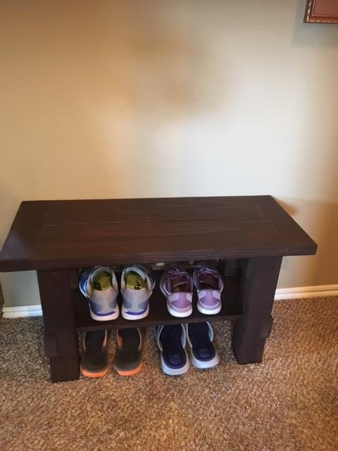 entryway bench with shoes showing