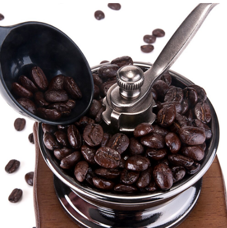 close up of coffee beans in grinder