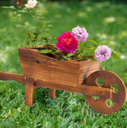 wheelbarrow planter in garden