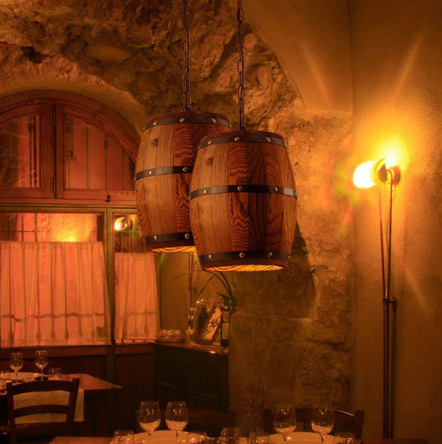 oak barrel lights hanging in the wine cellar